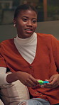 Woman, toys and psychology in office for help, smile and assessment on sofa at night. African person, gears and wheel for mental health with discussion, advice and happy with consulting at startup