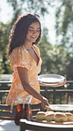 Prepare, outdoor or happy woman with plates for table for party, event and celebration gathering in home. Christmas lunch, smile or setting for dinner, meal prep and serving dishes for catering decor