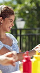 Friends, laugh and funny joke with food in garden for celebration, new years event or lunch. Bonding, party and eating with group of people in home for summer social, reunion and bbq together