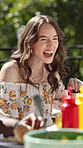 Friends, laughing and happy woman with food in backyard for celebration, new years event or lunch. Bonding, funny and eating with funny people in home for outdoor party, reunion and bbq meal together
