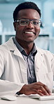 Science, typing and face with black man in laboratory for innovation, healthcare and glasses. Medical research, idea and pathology with person for expert, biotechnology and scientist report.