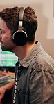 Man, editing and producer with headphones, music and listening to audio, recording and entertainment. Creative, electronic and production for sound engineer, bass and person with equipment and media