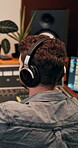 Back, listening and producer with headphones, music and editing of audio, recording and entertainment. Creative, electronic and production for sound engineer, bass and person with equipment and media