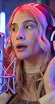 Music studio, singing and woman with headphones, recording and artist with talent for performance and neon. Creative, singer and person with microphone for sound, production or song for entertainment