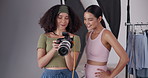 Woman photographer, model and checking pictures for studio photoshoot, image review or happy on backstage set. Production, people and photography analysis for magazine catalog and creative media