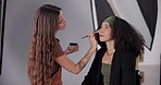 Woman, stylist or makeup in studio for photography, shoot or production aesthetic. Cosmetics artist, model or touch up on media agency set for preparation, process or behind the scene for videography