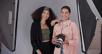 Photographer, model and face for photography, media and magazine cover in creative studio. Camera woman, portrait and people backstage for shooting, production and fashion director with backdrop