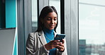Business woman, typing and window with phone for social media, online chatting or texting at office. Female person, financial advisor or investor with mobile smartphone for app, email or notification