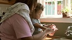 Cleaning, washing hands and mother with baby with soap for hygiene, child development and wellness. Family home, teaching and mom with kid by sink with water for health, bacteria protection and germs