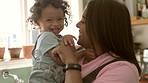 Happy, mom and baby laughing together with love, bonding and tickle game in home with child, mother and family. Face, smile and mommy relax with girl in funny, laugh or happiness in motherhood