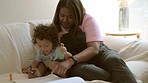 Home, baby and mother with love, writing and education with growth, learning and creative with fun. Mama, female parent or infant with a mom, couch and book with child development, teaching and relax