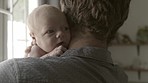 Father with baby, love and family with bonding for relationship, hug and cuddle child at home. Man rock newborn to sleep, new dad and affection with care in bedroom