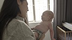Mother with baby, love and family with bonding for relationship, hug and cuddle child at home. Woman rock newborn to sleep, new mom and affection with care in bedroom