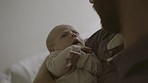 Father with baby, love and family bonding for relationship, hug and cuddle child at home. Man rock newborn to sleep, new dad and affection with care in living room