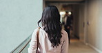 Walking, back and office with businesswoman in lobby for corporate seminar or travel in morning. Conference, convention center or professional person in building for coffee break or leaving workplace