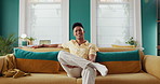 Home, couch and face of man on sofa with smile for holiday, weekend off and relax in living room. Modern house, chill or male person with confidence for comfort, resting and pride on couch in France
