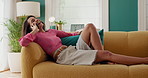 Happy woman, relax and laughing with phone call on sofa for funny chat, conversation or discussion at home. Female person, talking or smile with mobile smartphone on couch for communication or app