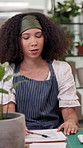 Woman, florist and documents with checklist for agro business, inventory or stock at office desk. Female person, environmentalist or floral designer with paperwork for budget, expenses or finance