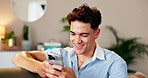 Phone, smile and social media with man on sofa in living room of home for browsing dating app profiles. Contact, relax and text message with happy person in apartment for mobile or online chatting