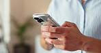 Man, hands and phone in home for social media, text message and ecommerce. Person, mobile networking and typing in living room for status update, communication and online shopping on app with service