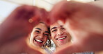 Frame, heart hands or portrait of man and woman in home together for bonding, love or romance on valentines day. Emoji, shape and smile of couple in living room of apartment for dating or marriage