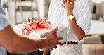 Couple, hands and surprise with gift in home for valentines day, anniversary and present for relationship. Love, people and giving ribbon box for celebration, special date and support with romance