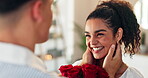 Flowers, romance and smile with couple in home together for anniversary or valentines day. Hug, present and thank you with man giving bouquet to woman in apartment for celebration, gift or love