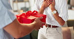 Couple love, hands and surprise with gift box for valentines day, romantic gesture and present for anniversary. Guess, people or giving ribbon package for celebration, special date or support in home