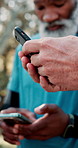 Senior people, hands or typing with phone for data sync, network connection or social media in nature. Closeup, elderly or group with mobile smartphone for sharing app or connectivity at outdoor park