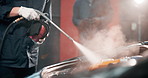 Mechanic, hands and pressure wash car in garage for deep cleaning, fixing preparation and maintenance. Motor industry, person or water spray vehicle with machine for repair service or auto inspection