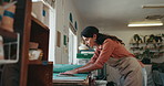 Woman, clay and design in workshop for small business, shape material or manufacturing. Entrepreneur, pottery or slab roller on table for creative process, artist and startup shop for handmade crafts