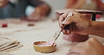 Hands, painting and pottery with people in workshop closeup for crafts, creative hobby or lesson. Ceramic, paintbrush and terracotta with artistic students in studio, learning how to create artwork