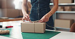 Woman, tie and hands with box for delivery, supply chain or packaging order at warehouse. Small business, strings or owner wrapping parcel, cargo or product for shipping or courier service at shop