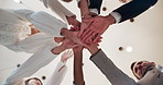 Huddle, teamwork and hands together of business people in office for solidarity, b2b merger and connection. Collaboration, support and growth with low angle of employees for commitment and synergy