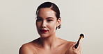 Girl, face and makeup brush in studio for beauty, application and change with results by white background. Woman, model and cosmetics test with powder, foundation and transformation in Costa Rica