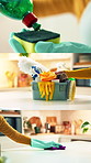 Cleaning, hygiene and montage of person in kitchen of home for chores or professional housekeeping. Hands, gloves and products with cleaner or housekeeper in apartment to remove bacteria and germs