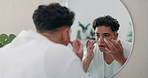 Man, mirror and skincare with face cream for facial grooming, hygiene or anti aging treatment in bathroom. Male person, reflection and applying lotion with moisturizer for dermatology or soft skin