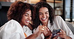 House, cellphone and women with smile, friends and connection with humor in lounge. Apartment, people and girls with online joke, smartphone and mobile app for social media, funny meme and laughing