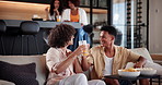 Men, excited and cheers on sofa for sports, team score and winning goal in match on TV. Friends, happy and cheering in home for announcement, energy and competition result at social gathering