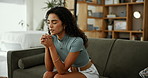 Woman, praying and faith on couch in home with worship, praise or gratitude to start morning in living room. Person, religion and girl with talk to God, Jesus and giving thanks for blessings in house