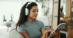 Streaming, headphones and woman with tablet, home and listening to sound with tech and subscription. Online, entertainment and person with app for movies, browsing or relax on break with social media
