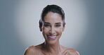 Happy, beauty and skincare with face of woman for dermatology, anti aging and collagen production. Spa, wrinkle treatment and self care with mature person on studio background for glow and cosmetics