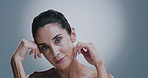 Skincare, beauty and face of mature woman in studio with antiaging, hydration and collagen treatment. Health, natural and portrait of female person with facial dermatology routine by gray background.