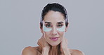 Eye mask, beauty and face of happy woman in studio for wellness, anti aging or dark circles. Dermatology, health and portrait of person with pad for skincare, cosmetics or collagen on gray background