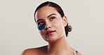 Studio, woman and skincare with eye patch for dermatology, facial and mask product for dark circles. Mockup, female person and beauty with gel for antiaging treatment, cosmetics and white background