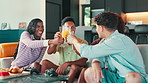 Celebration, social gathering and toast with friends on sofa in living room of home for healthy eating. Drink, fruit and juice with group of happy friends in apartment together for bonding or reunion