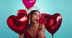 Heart, balloons and happy woman in studio with kiss, celebration or valentines day gift. Red shape, romantic offer and face of female person with love emoji, present and excited on blue background