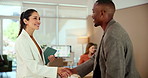 Business people, meeting and discussion with laptop for project proposal, idea or collaboration at office. Group, employees or team with computer for design, planning or task delegation at workplace
