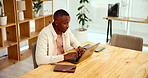 Typing, planning and black man in office with laptop for business schedule, growth or development. Research, networking or web consultant at desk with ideas for online account management at startup