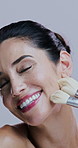 Makeup brush, happy and face of woman in studio on gray background for wellness, skincare and beauty. Cosmetology, application and portrait of mature person with tool for cosmetics, powder or product
